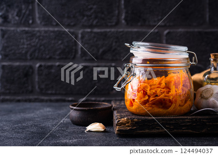 Spicy korean carrot salad in jar 124494037