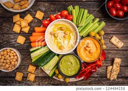 Various hummus dips, healthy and vegan snack Various hummus dips, healthy and vegan snack 124494158
