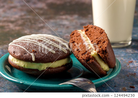 Whoopie pie with orange cream. Delicious homemade dessert 124494230