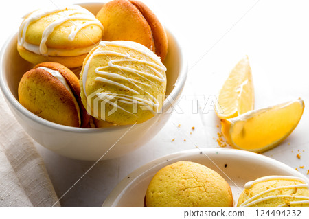 Homemade round lemon cookies. French sweet yellow cookies macarons Homemade round lemon cookies. French sweet yellow cookies macarons 124494232