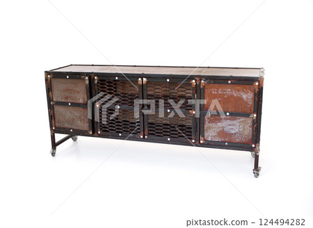 Vintage industrial metal cabinet with mesh and rusted panels on caster wheels. Aged storage unit with a rugged Vintage industrial metal cabinet with mesh and rusted panels on caster wheels. Aged storage unit with a rugged 124494282