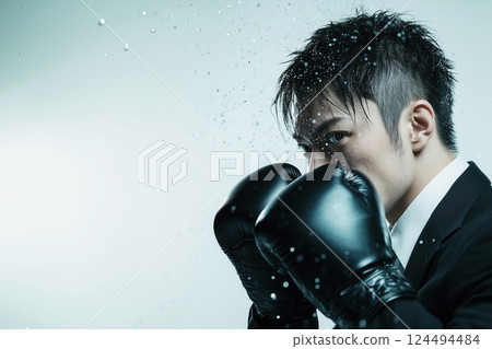 A businessman with a strong fighting spirit at work A businessman with a strong fighting spirit at work 124494484