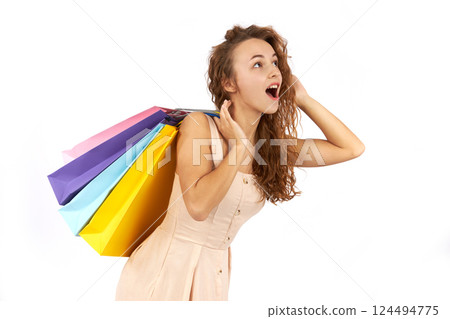 Girl with bags and purchases in a store. 124494775