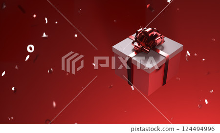 A beautifully designed Festive Gift Box placed in a bright and cheerful Red Holiday Setting 124494996
