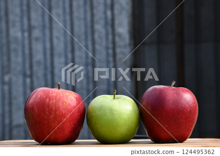 3 or three yellow apples on a clay plate isolated on a wooden 3 or three yellow apples on a clay plate isolated on a wooden 124495362
