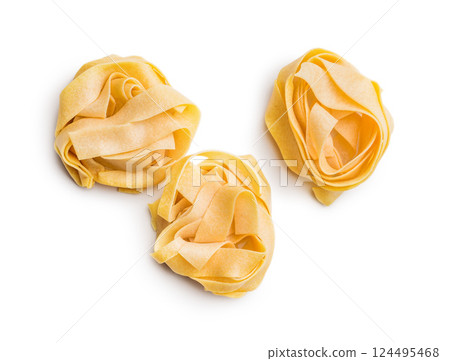 Italian pasta tagliatelle. Uncooked noodle pasta isolated on white background. 124495468