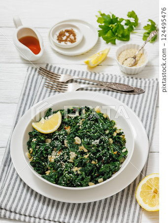sauteed kale with garlic, onion, red pepper flakes 124495476