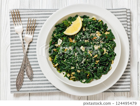 sauteed kale with garlic, onion, red pepper flakes sauteed kale with garlic, onion, red pepper flakes 124495479