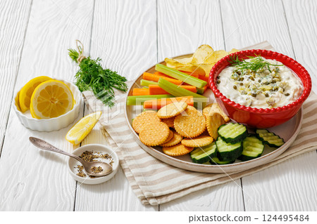 creamy yogurt pickles caper dill dip in red bowl creamy yogurt pickles caper dill dip in red bowl 124495484