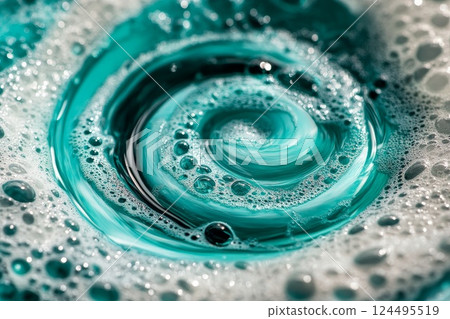A watery spiral with shades of turquoise and white foam streaks A watery spiral with shades of turquoise and white foam streaks 124495519