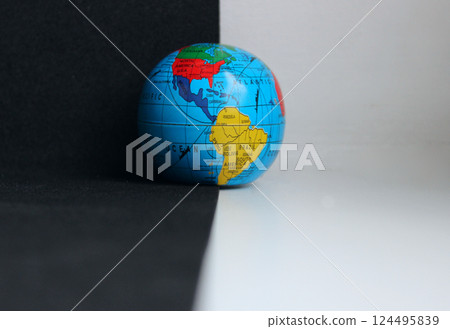 Earth Model on Background Divided with Black and White Colors Earth Model on Background Divided with Black and White Colors 124495839