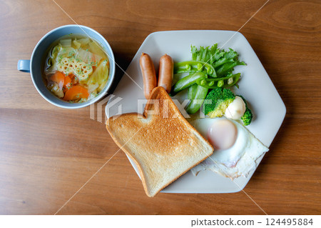 Western breakfast plate with toast and fried egg Western breakfast plate with toast and fried egg 124495884
