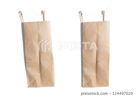 Pair of empty brown paper bags isolated on white background Pair of empty brown paper bags isolated on white background 124497020