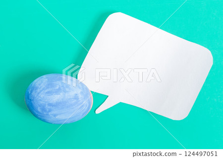 Happy Easter, Blue egg and speech bubble on a turquoise background. Happy Easter, Blue egg and speech bubble on a turquoise background. 124497051