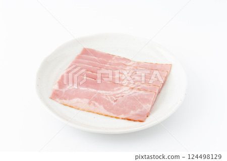 Slices of bacon on a plate 124498129