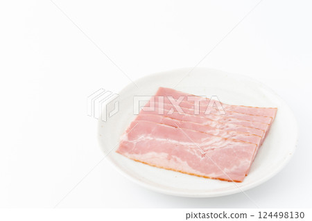 Slices of bacon on a plate 124498130