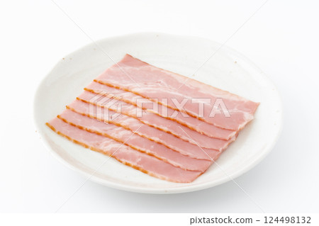 Slices of bacon on a plate 124498132