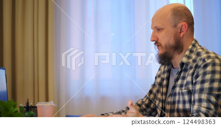 Man implements new software to spur progress, trusting progress for modern office tasks, aiming for progress that streamlines operations and elevates overall workflow. Remote work of man at computer Man implements new software to spur progress, trusting progress for modern office tasks, aiming for progress that streamlines operations and elevates overall workflow. Remote work of man at computer 124498363