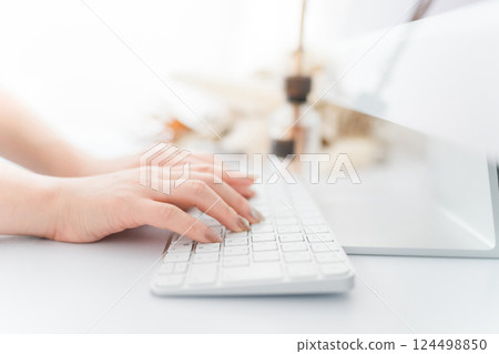 Woman with nails using a computer (work, gel nails, fashion designer) Woman with nails using a computer (work, gel nails, fashion designer) 124498850