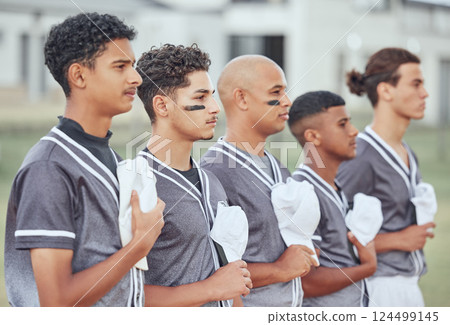 Anthem, baseball and field with team, national and proud with hat, hand and chest for respect at game. Man, diversity and sports in teamwork, contest or baseball player in group, focus or attention 124499145