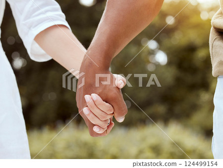 Diversity, holding hands and couple being romantic, support and being together for relationship, marriage and unity. Multiracial, hand gesture and interracial for romance, outdoor holiday and union. Diversity, holding hands and couple being romantic, support and being together for relationship, marriage and unity. Multiracial, hand gesture and interracial for romance, outdoor holiday and union. 124499154