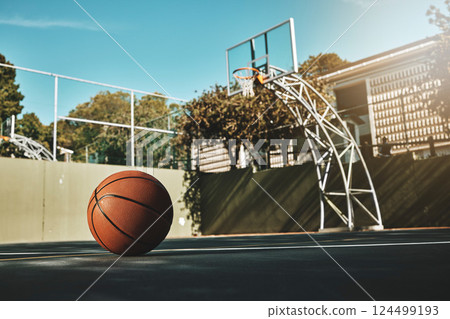 Basketball, outdoor and court with ball on floor for athletic competition or recreation low angle. Exercise, cardio and empty basketball court ground with basket for sports, match or workout. Basketball, outdoor and court with ball on floor for athletic competition or recreation low angle. Exercise, cardio and empty basketball court ground with basket for sports, match or workout. 124499193