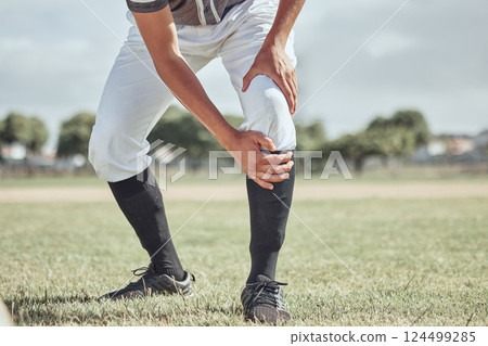 Baseball leg injury, man and sports athlete on a outdoor grass field hurt in the summer. Baseball player experience a muscle pain from workout exercise, fitness and cardio game training accident 124499285
