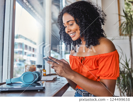 Coffee shop, black woman and phone while happy, excited and typing on phone for communication app with cafe wifi. Freelancer female on internet to blog, social media and do remote work on internet Coffee shop, black woman and phone while happy, excited and typing on phone for communication app with cafe wifi. Freelancer female on internet to blog, social media and do remote work on internet 124499638
