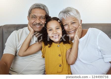 Family, happy and girl on a home living room sofa with grandparents love and care together. Portrait of senior people and a child with happiness smiling on a house lounge couch spending quality time Family, happy and girl on a home living room sofa with grandparents love and care together. Portrait of senior people and a child with happiness smiling on a house lounge couch spending quality time 124499738