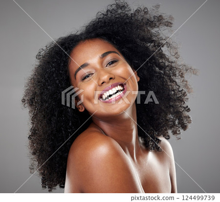 Black woman, smile and hair for face, makeup and happy with beauty, afro and cosmetics in studio portrait. Model, happiness or skincare with cosmetic, shine or glow for healthy, hair care or wellness 124499739