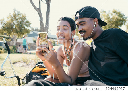 Couple, phone and video on social media in park, app or internet with smile, laugh or happiness. Black woman, man and smartphone for meme, social network or video call on web, online or communication 124499917