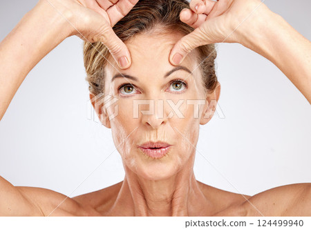 Senior woman, beauty portrait and face lift on gray studio background. Wellness, skincare model and lady from Canada with spa aesthetic for skin anti aging, cosmetics or healthy facial care treatment 124499940