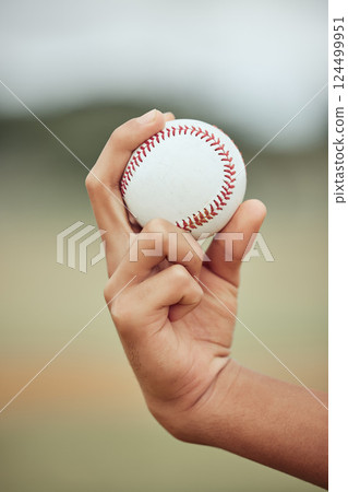 Baseball, sports and sport exercise of a hand about to pitch and throw in pitch. Fitness man, training and baseball player workout of a athlete in outdoor holding a ball for a game or practice skill 124499951