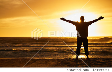 Silhouette of man with view, sunset and beach with arms out by the ocean, carefree and peace, freedom on vacation outdoor. Free, sunshine and hands up, travel and adventure in nature, sea water. Silhouette of man with view, sunset and beach with arms out by the ocean, carefree and peace, freedom on vacation outdoor. Free, sunshine and hands up, travel and adventure in nature, sea water. 124499964