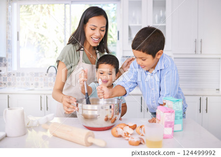 Baking, kids and mom in the home kitchen cooking food with a boy and baby with happiness. Family, mother and happy children smile at a house teaching with ingredients together smiling in family home 124499992