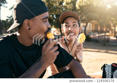 Ice cream, sweet and couple in city with food during travel, adventure and holiday in street. Happy, young and relax man and woman eating ice dessert on a date during vacation in a park during summer 124500178