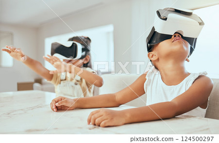 Vr, technology and children in their home, playing with headset on streaming videos, games and metaverse ux. Tech, 3d and kids with virtual reality goggles on for movies, gaming and futuristic fun 124500297
