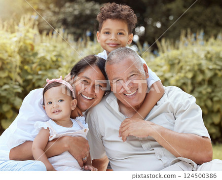 Family, children and happy grandparents bonding together outdoor with a baby and smile in nature. Portrait of kids, elderly people and young girl from Spain with happiness and quality time in a park 124500386
