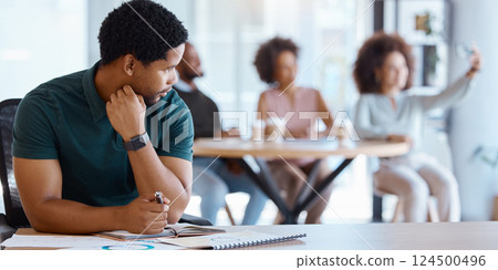 Business people, lonely and black man working in the office while colleagues take selfie. Conflict, reject and antisocial businessman at work alone, sad and social outcast in corporate workplace 124500496