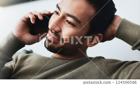 Phone call, relax and man on sofa in home for communication, social networking and chatting. Living room, house and person listening on smartphone for contact, online conversation and connection 124500586