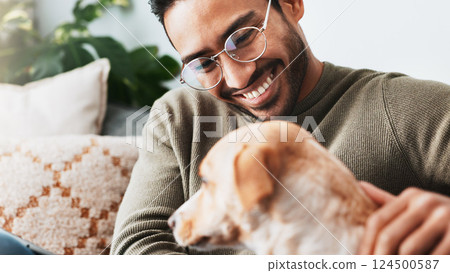 Smile, man and play with dog in living room for love, care and bonding together as friends or companion. Pet animal, scratch and person in home on sofa for support, connection and relax with tablet 124500587