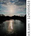 Sunset and bridge reflected in the river 124500828