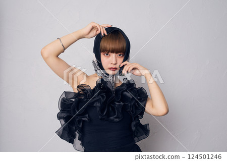 A woman in a black dress A woman in a black dress 124501246