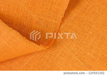 orange hemp viscose natural fabric cloth color, sackcloth rough texture of textile fashion orange hemp viscose natural fabric cloth color, sackcloth rough texture of textile fashion 124501302
