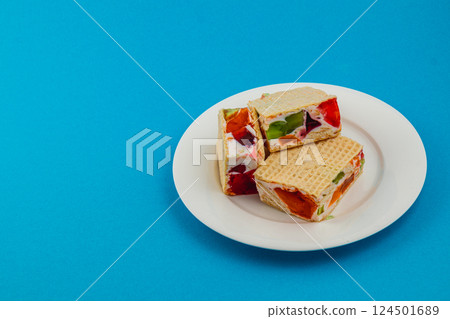 Creamy jelly waffle cakes with fruit toppings for dessert Creamy jelly waffle cakes with fruit toppings for dessert 124501689