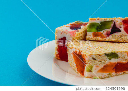 Delightful jelly waffle cakes with fruit cream topping 124501690
