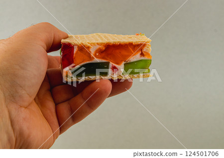 Colorful jelly and cream filled waffle dessert treat 124501706