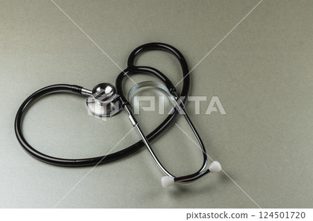 Stethoscope resting on a gray surface in a clinic Stethoscope resting on a gray surface in a clinic 124501720