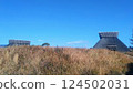 Blue sky and pit dwellings 124502031