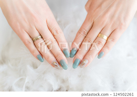 Woman's hands with gel nails and nail art at a nail salon 124502261